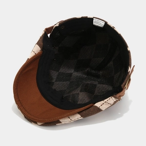 Classic checkered flat cap featuring black cotton lining and detailed material care label