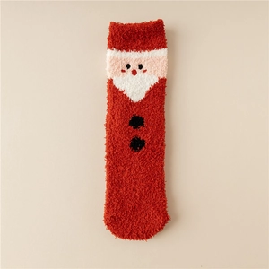 Detailed close-up of a plush coral fleece Christmas sock featuring a Santa Claus design