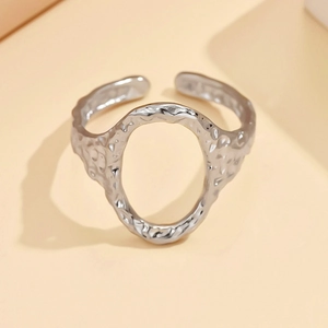 Adjustable silver irregular hollow oval ring with hammer texture finish in stainless steel