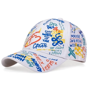 Detail shot of white cotton canvas baseball cap featuring colorful graffiti print text