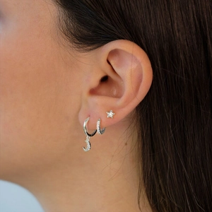 Close-up of S925 silver earring set with star, moon charms and sparkling crystals