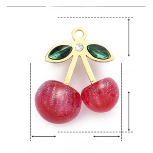 Macro view of cherry pendant dimensions: 25mm height by 21mm width in stainless steel