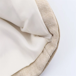 Gros plan sur tissu en lin beige avec doublure en sergé et coutures de haute qualité