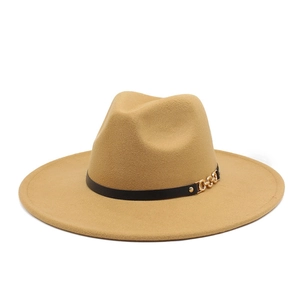 Detail of khaki wool fedora hat featuring a thin black leather band and gold chain buckle