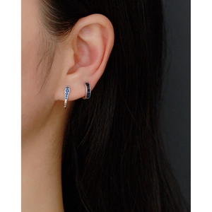 Close-up of S925 sterling silver U-shaped ear cuffs with blue cubic zirconia on ear