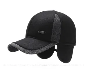 Close-up of winter baseball cap for men featuring a sport metal tag and ear protection