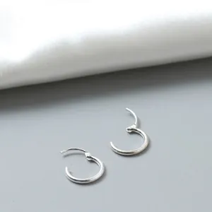 Minimalist S925 sterling silver hoop earrings with a sleek circular clasp design
