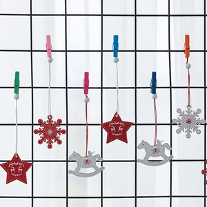 Nordic wooden Christmas ornaments with red stars, white snowflakes and rocking horse