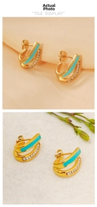 Detail of C-shaped 18K gold earrings with turquoise enamel and micro-inlaid diamonds
