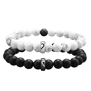 Couples beaded bracelets with white marble and matte black stones and matching heart charm