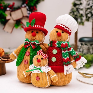 Close-up of knit texture on three gingerbread plush dolls in a cozy Christmas setting