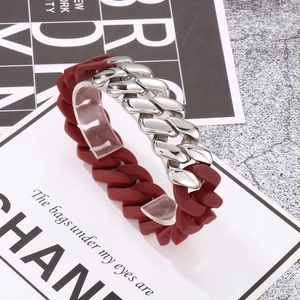 Macro shot of a 316L stainless steel Cuban chain bracelet with reddish-brown matte links