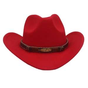 Detail of red cowboy hat with leather band and gold feather metal buckle accent