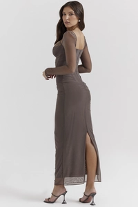 Detail view of a slim fit backless dark brown mesh maxi dress with a side slit design