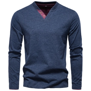 Detail of greyish blue Henley shirt featuring burgundy contrast placket and wood buttons