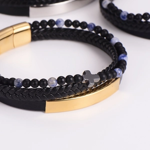 Men's multilayer punk bracelet set with black leather, beads, and a gold cross charm