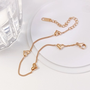Detailed view of rose gold heart bracelet with clear crystals and adjustable lobster clasp