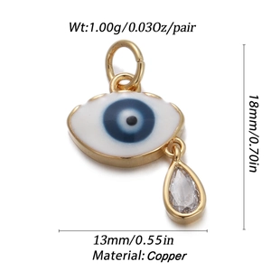 Detailed view of evil eye charm with blue enamel and teardrop zircon on copper base