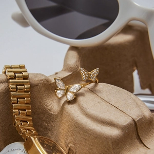 Detailed macro view of golden butterfly ring featuring marquise-cut cubic zirconia crystals
