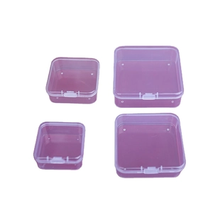 Set of four purple transparent square plastic organizer boxes in various sizes