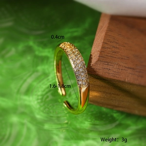 Macro shot of gold zircon geometric ring showing 0.4cm width and dimensions