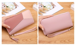 Close-up of pink long patchwork wallet with leather tassel and gold zipper detail