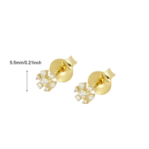 Close-up of 5.5mm gold flower stud earrings with sparkling crystals for women