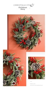 Detailed view of snowy Christmas wreath with red berries, pine cones and wooden stars