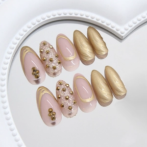 Champagne diamond sparkling almond press-on nails with golden glitter and rhinestones