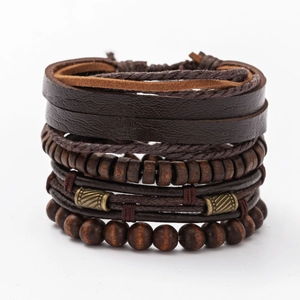 Detail of multi-layer leather bracelets with dark wood beads and bronze metal accents