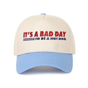 Detailed embroidery of 'IT'S A BAD DAY TO BE A HOT DOG' on two-tone baseball cap