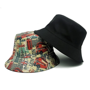 London digital print bucket hat and black sun cap with Big Ben and double-decker bus
