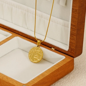 Gold-plated stainless steel coin necklace with sun and sailboat relief on snake chain