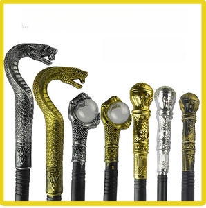 Detail of 3-piece Egyptian pharaoh and king scepter heads with cobra and claw motifs