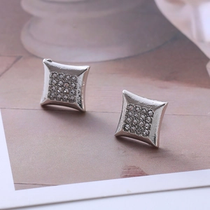Macro shot of silver square stud earrings featuring micro-paved crystal zircons