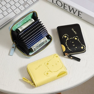 Three bear-pattern accordion card wallets in blue, black, and yellow with zipper