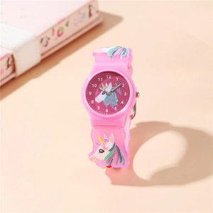 Pink unicorn quartz kids watch with 3D silicone strap and clear dial on a pastel desk