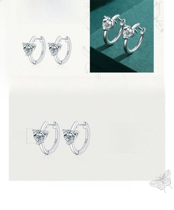 Detail of S925 sterling silver heart earrings with sparkling cubic zirconia stones