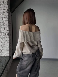 Chic beige off-shoulder knitted sweater with elegant draped back and slim-fit silhouette