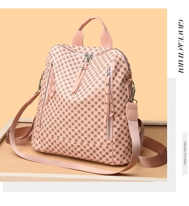 Detail of pink PU leather backpack featuring vintage geometric patterns and functional zippers
