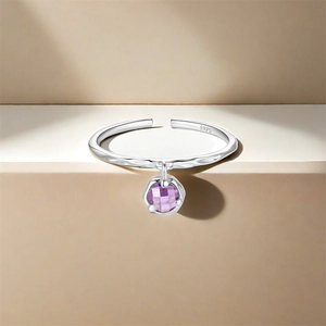 Detailed shot of S925 sterling silver adjustable ring with purple zircon pendant charm