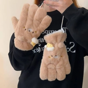 Detail of plush brown bear gloves with thick faux fur and mini knitted hat decor