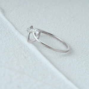 Macro view of S925 sterling silver stamp and geometric hollow diamond ring detail