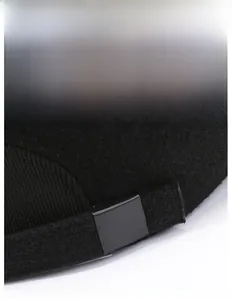 Detail of wool baseball cap with adjustable metal buckle and elastic strap for secure fit
