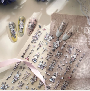 Detail of gothic bunny and heart pattern nail stickers with shimmering laser effect