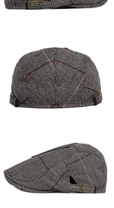 Detail of vintage herringbone wool flat cap with bronze metal adjustable side buckle