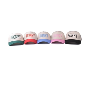 Five cotton baseball caps with Honey embroidery in green, red, blue, pink, and black