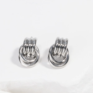 Detailed view of silver multi-layered hoop earrings with elegant metallic luster and texture