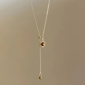 Vintage sun pendant necklace with tiger eye stone on elegant gold chain for women