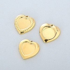 Three gold stainless steel heart pendants with beaded and plain edge designs for DIY jewelry